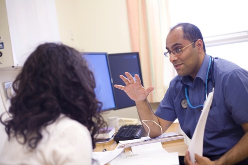 Patient Engagement Male Clinician Talking To Patient