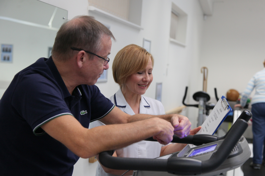 PR bike monitor female physio and male patient
